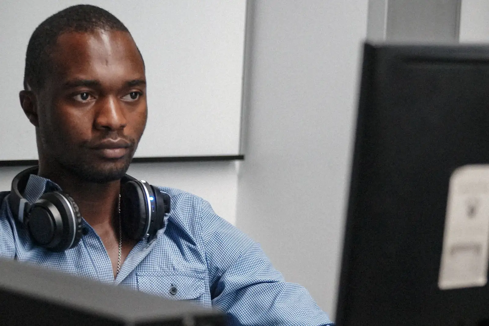 A man working at a computer in an office